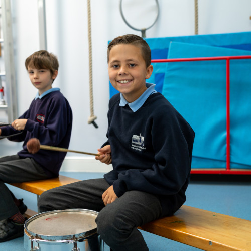 Music lesson boy smiling with drum